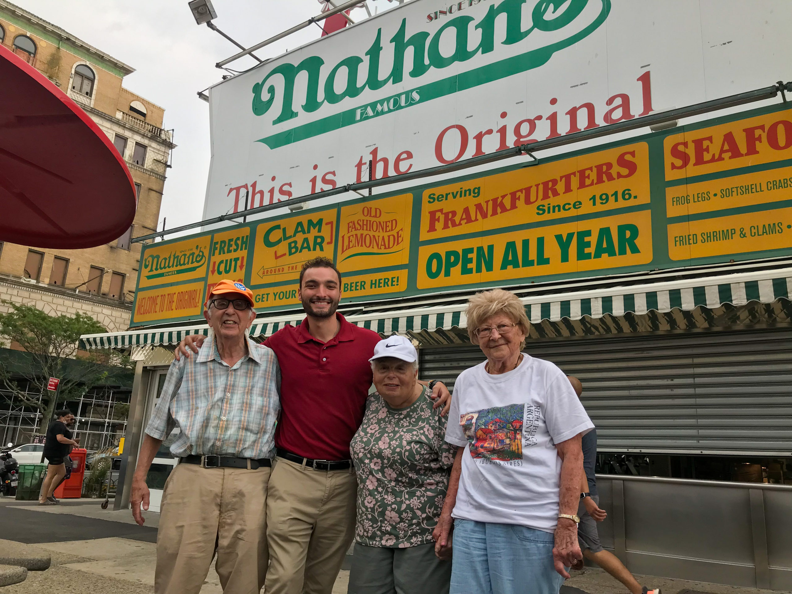 A few of our residents and our Lifestyle Director Christopher had a great time in Coney Island and eating at the original Nathan's Famous on National Hot Dog Day! / The Residences at Plainview